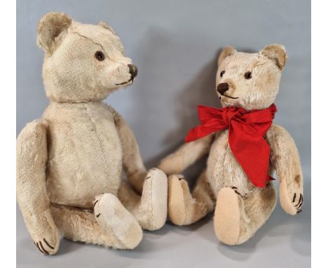 Mid century growling Steiff plush teddy bear with silver button on his left ear, glass eyes, stitched nose, moveable limbs an