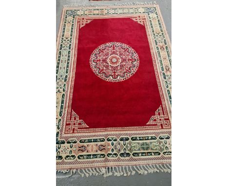 Large vintage hand woven carpet with weave design tassels in Middle Eastern design with central circular floral medallion, wi