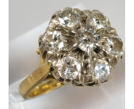 18ct gold diamond seven stone flowerhead cluster ring. 7.5g approx. Size O. (B.P. 21% + VAT) 