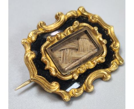 Two gold Mourning brooches, one with inscription 'Mrs Elizal Davis, dated 1883', together with a gold oval brooch inset with 