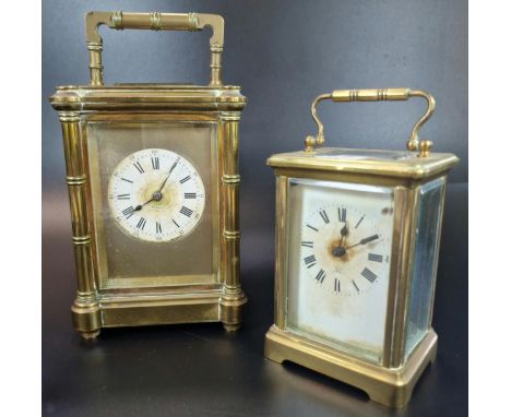 Two French brass carriage clocks to include large version with circular Roman face and projecting pilasters, striking on one 