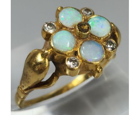 18ct gold flowerhead ring inset with four diamonds and four opals (missing one diamond). 5g approx. Size M. (B.P. 21% + VAT) 