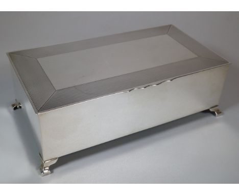 George V silver cigar box, of rectangular form, possibly Mappin &amp; Webb, the hinged lid with engine turned designs above a