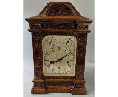 Early 20th century German three train architectural bracket clock, the case with architectural arched foliate pediment above 