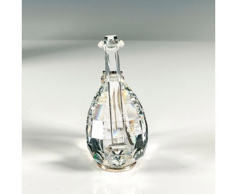This Swarovski Crystal instrument is a faceted cut crystal with stand. Swarovski etched backstamp. This item has its original