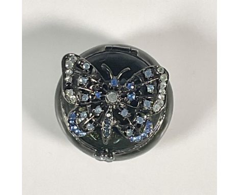A delightful miniature box in an enchanting enamel exterior and interior finish. Blue colored crystals encrusted on the butte