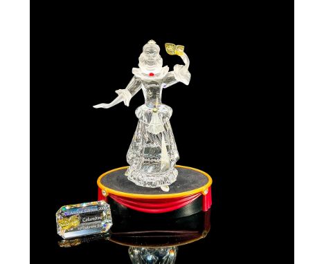 Brilliant clear crystal Harlequin with arm raised holding mask. Red, yellow and blue accent crystals. Satin head and arms. Sw