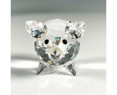 Multifaceted clear crystal with black eyes and wire curly tail. Swarovski etched backstamp. This item has its original box, 3