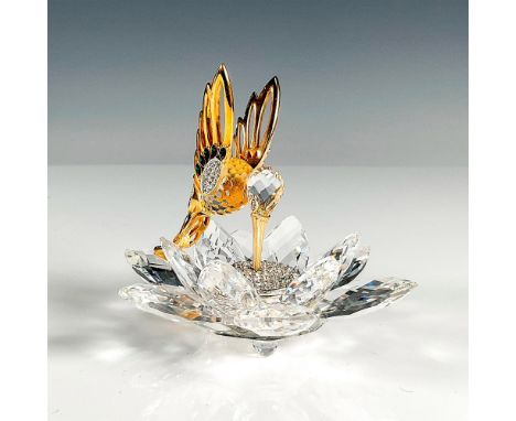 Part of the original Gold series of figurines, bird feeding off clear crystal center of flower. Birds body and wings are gold
