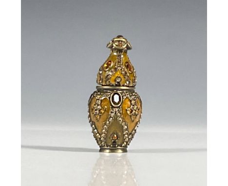 Charming jeweled and enameled miniature amber decorative box encrusted with amber colored crystal on exterior, with a hand en