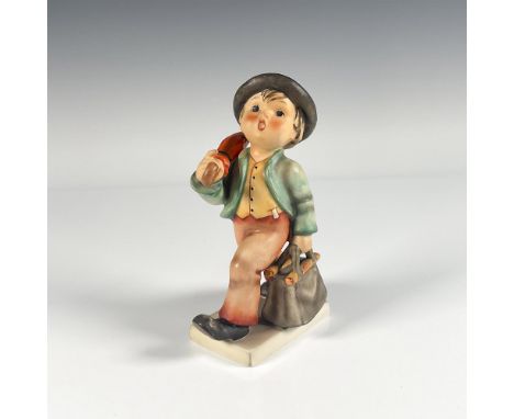 Hand painted in matte finish. Depicts a little boy walking with umbrella and bag. Goebel backstamp. Issued: 20th c.Dimensions
