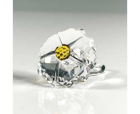 Multifaceted clear crystal with yellow stamen. Swarovski etched backstamp. This item has its original box, 3"H x 2.25"dia. Is