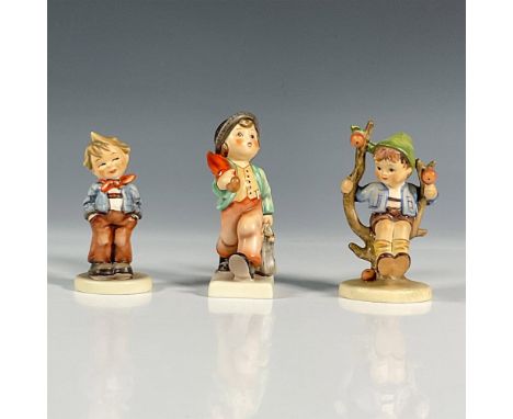 Three hand painted collectible figurines including Merry Wanderer, Scamp, and Apple Tree Boy. Depicted as three children doin