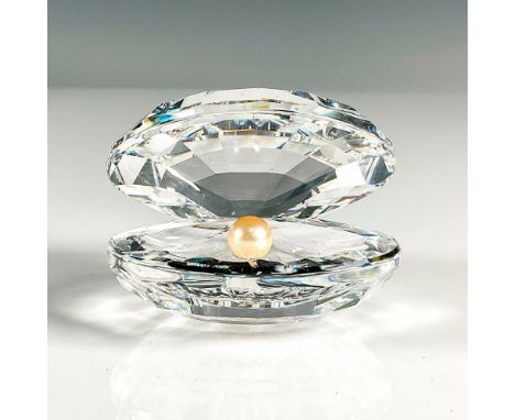 Multifaceted clear crystal. Swarovski etched backstamp. This item has its original box, 4"H x 5"dia. Issued: 20th centuryDime