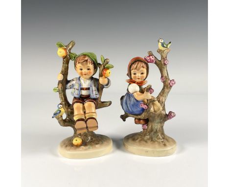 Hand painted porcelain figures in matte finish. Depicts a young German boy and girl happily relaxing in their apple trees. Go