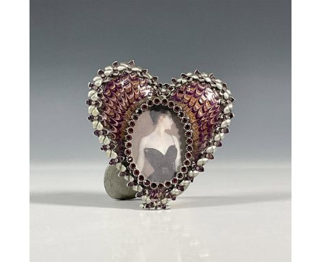 A lovely hand enameled over metal designed with handset purple crystal oval panel and further metal floral pattern encircling
