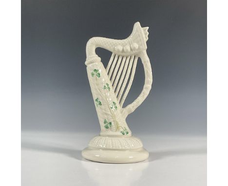 Attractive figurine of the musical instrument, the harp. Decorated with shamrocks, the harp symbolizes hope and music. Bellee