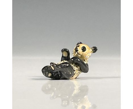 Black onyx and ivory multicolored enameled lying panda figurine embellished with shimmering Swarovski crystal throughout the 