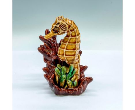 Hand painted figure of a seahorse with a brown glazed coral base. Ceramic Arts Studio marked on the undersides. Seahorse: 1.7