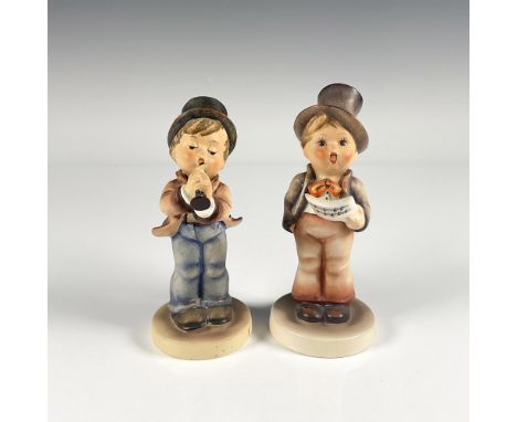 Hand painted figure in matte finish depicting two young boys; one plays the flute and other is a singer holding a sheet music