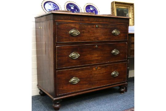 A Georgian Mahogany Chest Of Three Long Graduated Drawers Raised