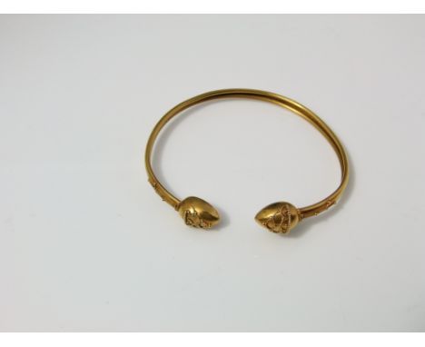 A celtic style 15ct gold Victorian bangle with applied beaded detail with leather case work