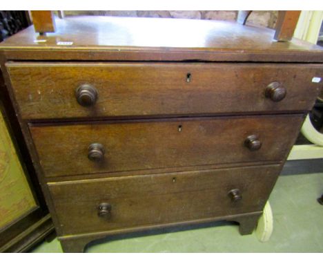 A small Georgian oak bedroom chest of three long graduated drawers raised on bracket supports, 84 cm wide approx