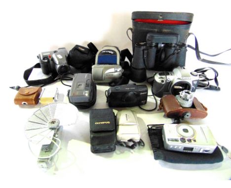 A collection of vintage photographic equipment to include a Bencini CMF Comet S camera, further vintage Canon and Olympus cam