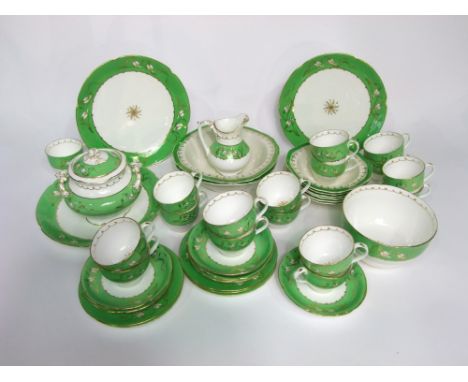 A quantity of Victorian tea wares with green and gilt border decoration comprising a sucrier and cover, a slop bowl, milk jug