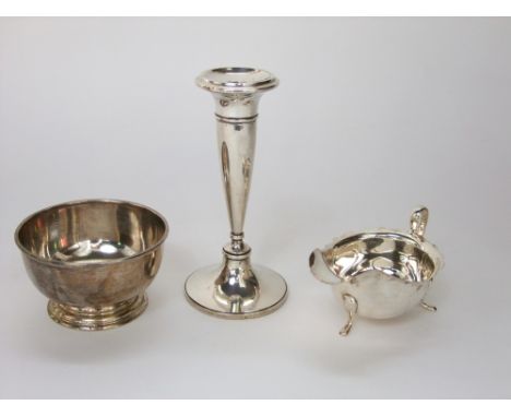A simple silver bowl, 11 cm diameter, London 1942, a Georgian style gravy boat with shaped outline, 280 gms total, together w