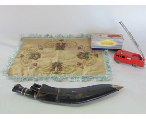 An antique Kokri knife set within a leather sheath, together with a boxed Dinky Supertoys model 955 fire engine with extendin