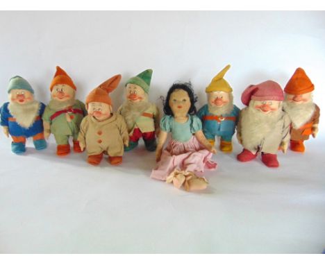 A complete 1930s Chad Valley assembly of Snow White and the Seven Dwarfs, all with moulded felt work bodies with painted faci