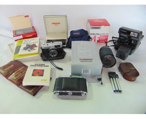 A box containing a collection of vintage photographic equipment to include a polaroid 636 close-up camera, other cameras by O