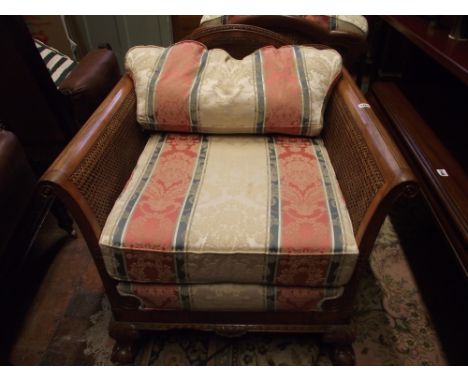 An Edwardian style three piece Bergere suite with three seat sofa and two matching chairs, with carved and moulded show wood 