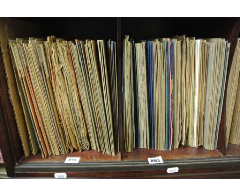 An extensive collection of vintage 78rpm records including artists such as Billie Holiday, Louis Armstrong, 'Fats' Waller, Je