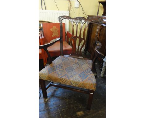 A Georgian Chippendale style chair with pierced gothic tracery splats on yoke shaped cresting rail, upholstered seat on squar