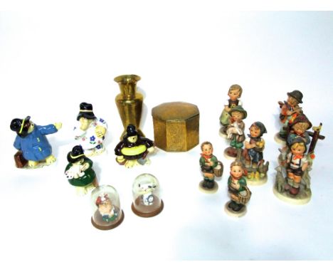 A collection of Hummel figures of children including little girl holding a posy, little girl with poultry, etc, together with