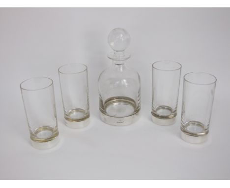 A heavy glass decanter and four large tumblers with silver bases by Links of London