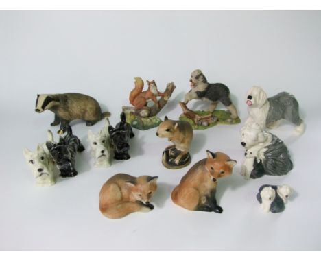 A collection of ceramic animals including a Royal Doulton group of an old English sheepdog and its pup, a further Royal Doult