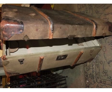 A 19th century reinforced cavas leather banded travelling trunk