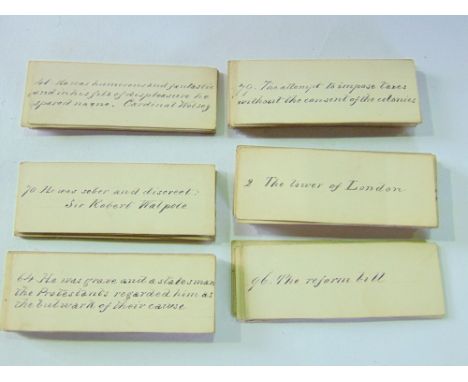 A box containing a collection of antique and vintage playing card decks together with numbered 19th century hand written info