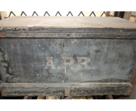 A 19th century stained pine tool chest with hinged lid and painted initials A.P.R, containing a quantity of miscellaneous han