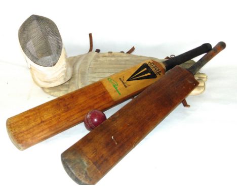 Vintage sporting effects to  include a laced leather rugby ball, two cricket bats, one stamped The Cannon, Gunn & Moore, Treb