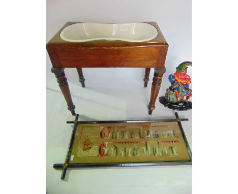 A Victorian mahogany commode stool with box cover together with a painted cast iron door stop in the form of Mr Punch, an emb