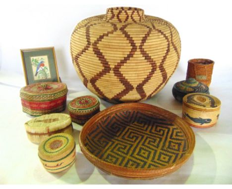 A selection of decorative stained wicker worked/woven grass boxes together with a large woven vase of squat form (displayed o