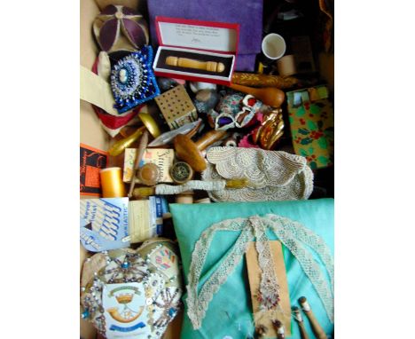 A box containing a collection of vintage sewing and embroidered effects to include numerous timber cotton reels (some still w
