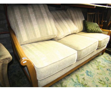 A contemporary three seat sofa, the light beechwood frame with down swept and shaped arms in oatmeal ground and green striped