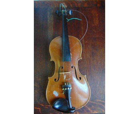 An old violin labelled to interior 'Copy of Stradivarius'