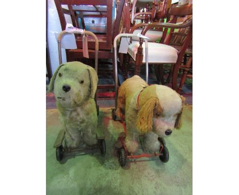 A vintage Tri-ang child's push along straw filled soft toy in the form a  St Bernard dog, together with one other