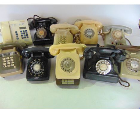 A selection of vintage telephones to include two black Bakelite cased examples with flex cords together with examples in ivor